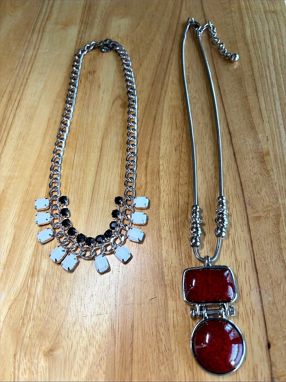 Two necklace set. Silver & Red Statement Necklaces and black and white necklace.